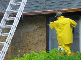 Power washing stucco house exterior in Bronxville, NY (Westchester County).